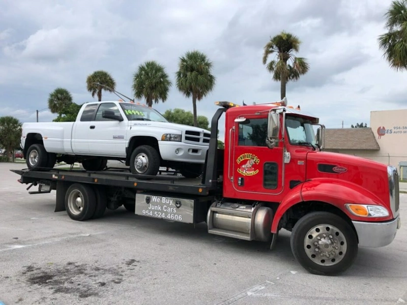 Tow trucks picking up junk cars in Sunrise FL for top dollar